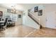 Bright and open office space with a staircase, neutral tile flooring, and a large window allowing plenty of natural light at 8084 Celina Hills St, Las Vegas, NV 89131