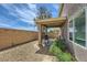 Gravel backyard with patio cover extending from the home's exterior at 8084 Celina Hills St, Las Vegas, NV 89131
