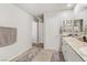 Bathroom showcasing white cabinets and neutral-toned tile flooring at 8351 Gold River Ct, Las Vegas, NV 89113