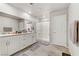 Modern bathroom features a double sink vanity and a glass door shower at 8351 Gold River Ct, Las Vegas, NV 89113
