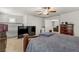 This bedroom includes a flat screen TV, plush carpet, and dark wood furniture at 8351 Gold River Ct, Las Vegas, NV 89113