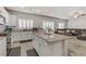 Open-concept kitchen features granite countertops, stainless appliances, and bright white cabinetry at 8351 Gold River Ct, Las Vegas, NV 89113