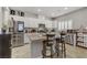 Modern kitchen with stainless steel appliances, granite countertops, and white cabinets at 8351 Gold River Ct, Las Vegas, NV 89113