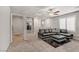 Second floor living room with black and white couch and plush carpet at 8351 Gold River Ct, Las Vegas, NV 89113