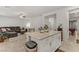 Open-concept layout featuring a kitchen island that connects to the living room area at 8351 Gold River Ct, Las Vegas, NV 89113