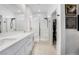 Modern bathroom featuring a double vanity, a glass shower and marble flooring at 892 Elmwood Forest Ln, Las Vegas, NV 89138