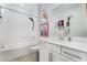 Well-lit bathroom features a tub-shower combination and stylish white vanity at 892 Elmwood Forest Ln, Las Vegas, NV 89138