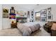 This stylish bedroom includes a gallery wall and a comfortable seating area at 892 Elmwood Forest Ln, Las Vegas, NV 89138