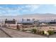 Stunning city view overlooking Las Vegas with a tile roof in the foreground at 892 Elmwood Forest Ln, Las Vegas, NV 89138