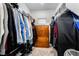 Walk-in closet features built-in shelving and ample storage for clothing and accessories at 892 Elmwood Forest Ln, Las Vegas, NV 89138