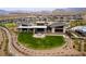 Aerial view of recreation lawn, fire pit and seating at community center at 892 Elmwood Forest Ln, Las Vegas, NV 89138