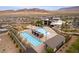 An aerial view of the community pool with many lounge chairs at 892 Elmwood Forest Ln, Las Vegas, NV 89138