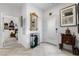 Welcoming entryway featuring herringbone floors, a gilded mirror, and unique decor at 892 Elmwood Forest Ln, Las Vegas, NV 89138