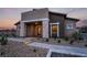 Charming single-story home with stone accents, desert landscaping, and covered entryway at 892 Elmwood Forest Ln, Las Vegas, NV 89138