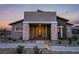 Charming single-story home with stone accents, desert landscaping, and covered entryway at 892 Elmwood Forest Ln, Las Vegas, NV 89138