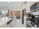 Stylish kitchen with sleek appliances and a seamless connection to the outdoor patio at 892 Elmwood Forest Ln, Las Vegas, NV 89138