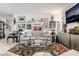 Well-appointed living room with a comfortable sofa and unique artwork at 892 Elmwood Forest Ln, Las Vegas, NV 89138
