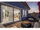 Outdoor patio with lounge seating and an open view into the home's interior at 892 Elmwood Forest Ln, Las Vegas, NV 89138