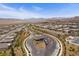 An aerial view of a neighborhood with a beautiful mountain backdrop at 892 Elmwood Forest Ln, Las Vegas, NV 89138