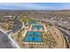 Aerial view of community tennis and pickle ball courts with mountain views at 892 Elmwood Forest Ln, Las Vegas, NV 89138