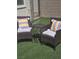 Backyard featuring a seating area with artificial grass and decorative pillows at 9159 Oxford Blue Ave, Las Vegas, NV 89148
