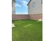 Spacious backyard with artificial grass, perfect for outdoor activities and relaxation at 9159 Oxford Blue Ave, Las Vegas, NV 89148