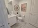 Well-lit bathroom with a vanity, toilet, and decorative accents at 9159 Oxford Blue Ave, Las Vegas, NV 89148
