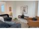 Comfortable living room with stylish furniture, neutral tones, and ample natural light at 9159 Oxford Blue Ave, Las Vegas, NV 89148