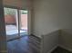 View to private backyard through the sliding glass doors, featuring a paved patio at 9463 Jumping Frog Ct, Las Vegas, NV 89147