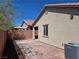The backyard features a concrete patio perfect for entertaining at 9463 Jumping Frog Ct, Las Vegas, NV 89147
