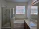 Beautiful bathroom featuring a separate shower, soaking tub, and dual sink vanity at 9463 Jumping Frog Ct, Las Vegas, NV 89147