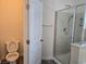 Bathroom with toilet and glass enclosed shower featuring stylish tile at 9463 Jumping Frog Ct, Las Vegas, NV 89147