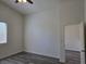 Spacious bedroom with wood-look flooring and a window for natural light at 9463 Jumping Frog Ct, Las Vegas, NV 89147