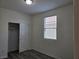 A bright bedroom features a closet with sliding doors, and wood-look floors for a modern touch at 9463 Jumping Frog Ct, Las Vegas, NV 89147