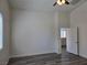 Well-lit bedroom with wood-look flooring, a ceiling fan, and large windows at 9463 Jumping Frog Ct, Las Vegas, NV 89147