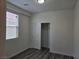Bright bedroom with wood-look flooring and a closet with sliding doors at 9463 Jumping Frog Ct, Las Vegas, NV 89147