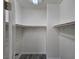 Walk-in closet with built-in shelving and wood-look flooring at 9463 Jumping Frog Ct, Las Vegas, NV 89147