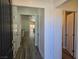 Inviting entryway featuring wood-look flooring and neutral paint, leading to the open living area at 9463 Jumping Frog Ct, Las Vegas, NV 89147