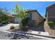 Well-kept home featuring a tile roof, desert landscaping, and a convenient two-car garage at 9463 Jumping Frog Ct, Las Vegas, NV 89147