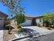 Beautiful single-story home with desert landscaping, a tile roof, and a spacious two-car garage at 9463 Jumping Frog Ct, Las Vegas, NV 89147