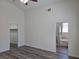 Primary bedroom with wood-look floors, ceiling fan, closet and an en suite bathroom at 9463 Jumping Frog Ct, Las Vegas, NV 89147