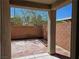 The covered patio boasts a tiled floor and a view of the backyard at 9463 Jumping Frog Ct, Las Vegas, NV 89147