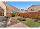 Outdoor space featuring artificial turf, stone and shade for relaxation and entertainment at 9737 Darlington Ct, Las Vegas, NV 89149