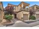 View of the front exterior and driveway of townhome at 9737 Darlington Ct, Las Vegas, NV 89149
