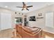 Cozy living room with wood floors, a ceiling fan and recessed lighting at 9737 Darlington Ct, Las Vegas, NV 89149