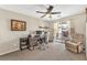 Home office featuring neutral walls, ceiling fan and a sliding door to a small balcony at 9737 Darlington Ct, Las Vegas, NV 89149