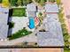 Expansive aerial view of a luxury home showcasing a sprawling backyard, a pristine pool, and lush landscaping at 9920 Rancho Destino Rd, Las Vegas, NV 89183