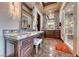 Bathroom featuring dual vanities and walk-in shower at 9920 Rancho Destino Rd, Las Vegas, NV 89183