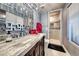 Modern bathroom with a sleek vanity, large mirror, and glass-enclosed shower at 9920 Rancho Destino Rd, Las Vegas, NV 89183