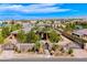 Stunning single-story home with gated entry, lush landscaping, and a circular driveway providing ample parking space at 9920 Rancho Destino Rd, Las Vegas, NV 89183